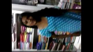 Indian young Student Relaxed on Inside Of book shop - Wowmoyback